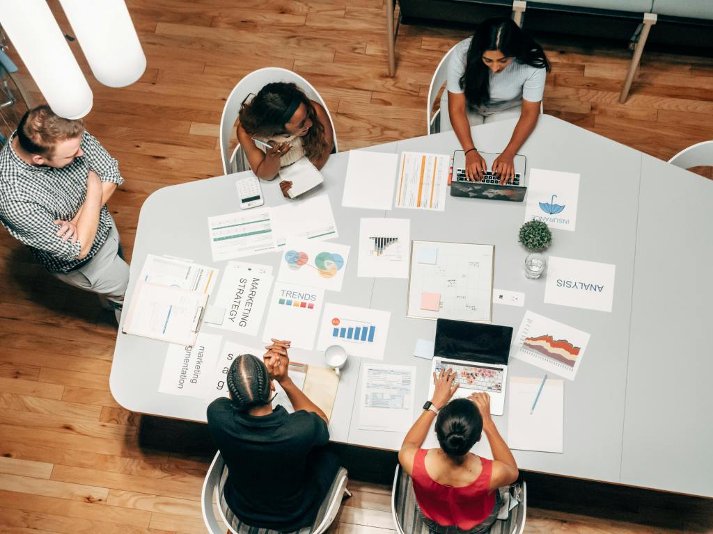 People in an office meeting room - BAM Group (hospitality consulting)